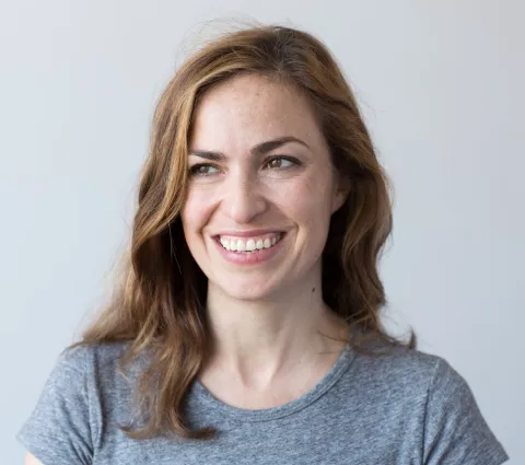 Lisa Brennan-Jobs smiling at the camera.