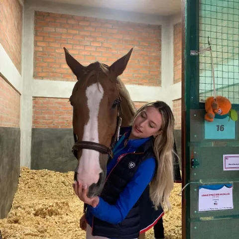 Eve Jobs' with Her Horse. 
